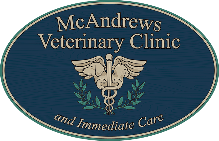 Emblem style logo with veterinary symbol for McAndrews Veterinary Clinic